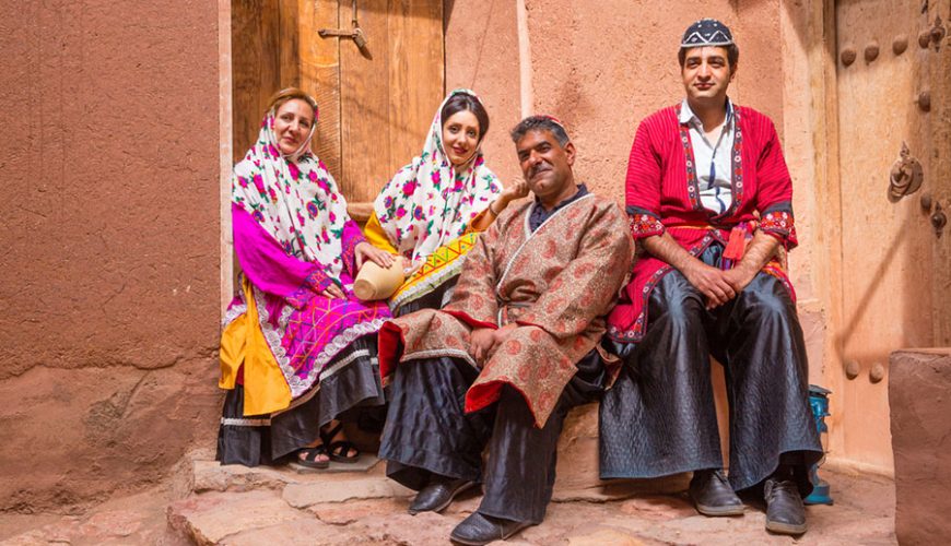 An Iranian Traditional clothing which belongs to Bakhtiary nomads among white lambs, Iransense Travel Agency