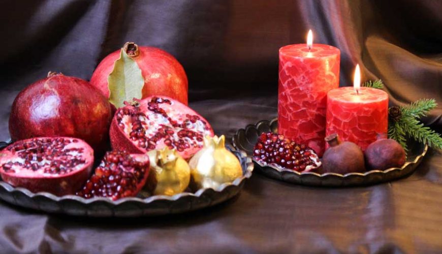 Yalda Night traditional table designed by special fruits like watermelon, pomegranate and persimmon and nuts, Iransense Travel Agency